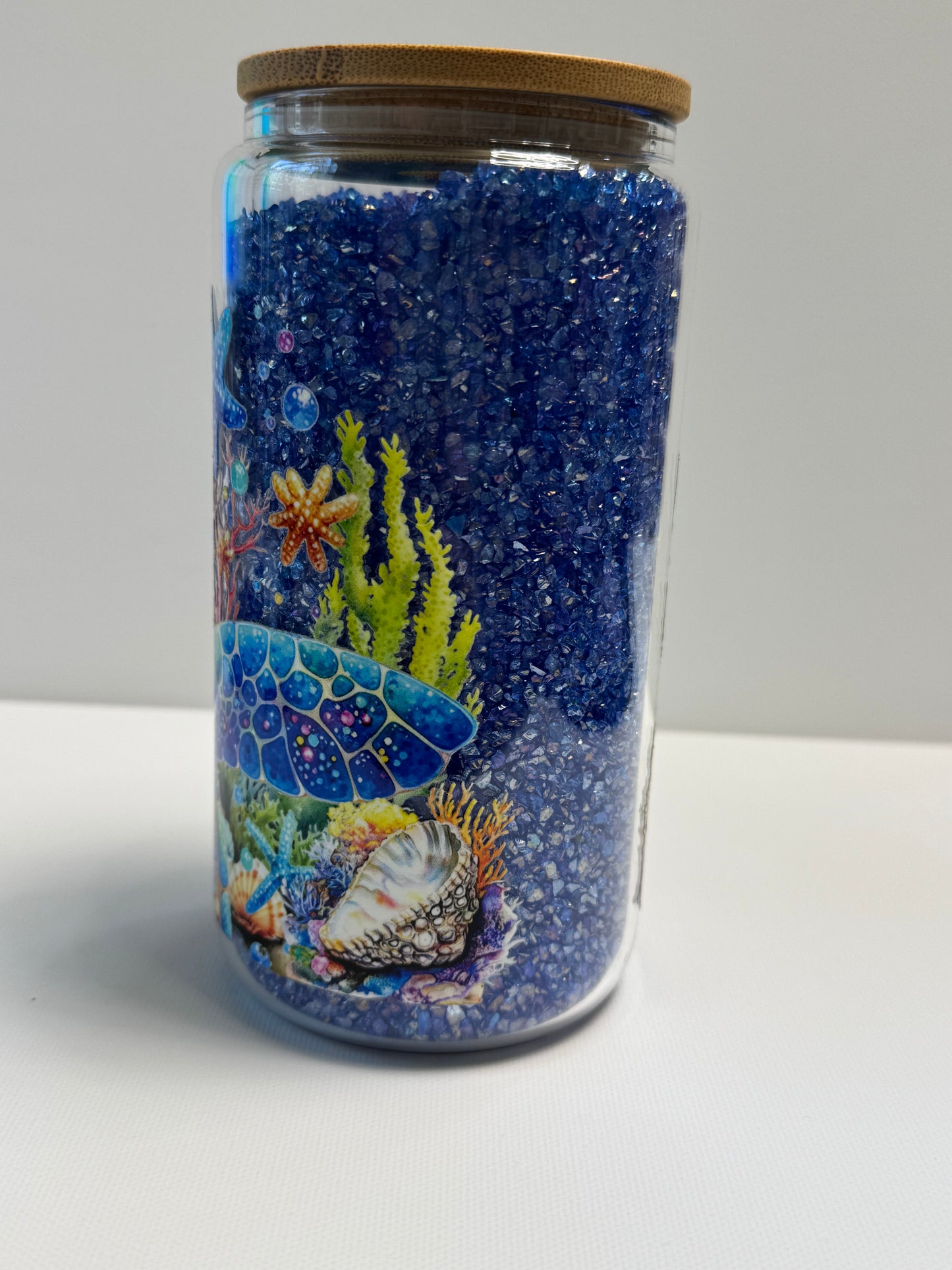 16oz Glass Snow Globe w/blue rhinestones an turtle wrap.