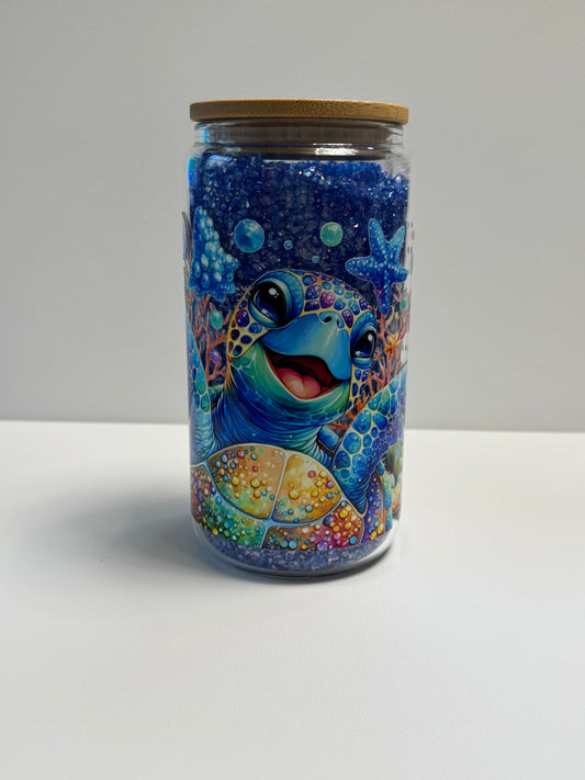 16oz Glass Snow Globe w/blue rhinestones an turtle wrap.