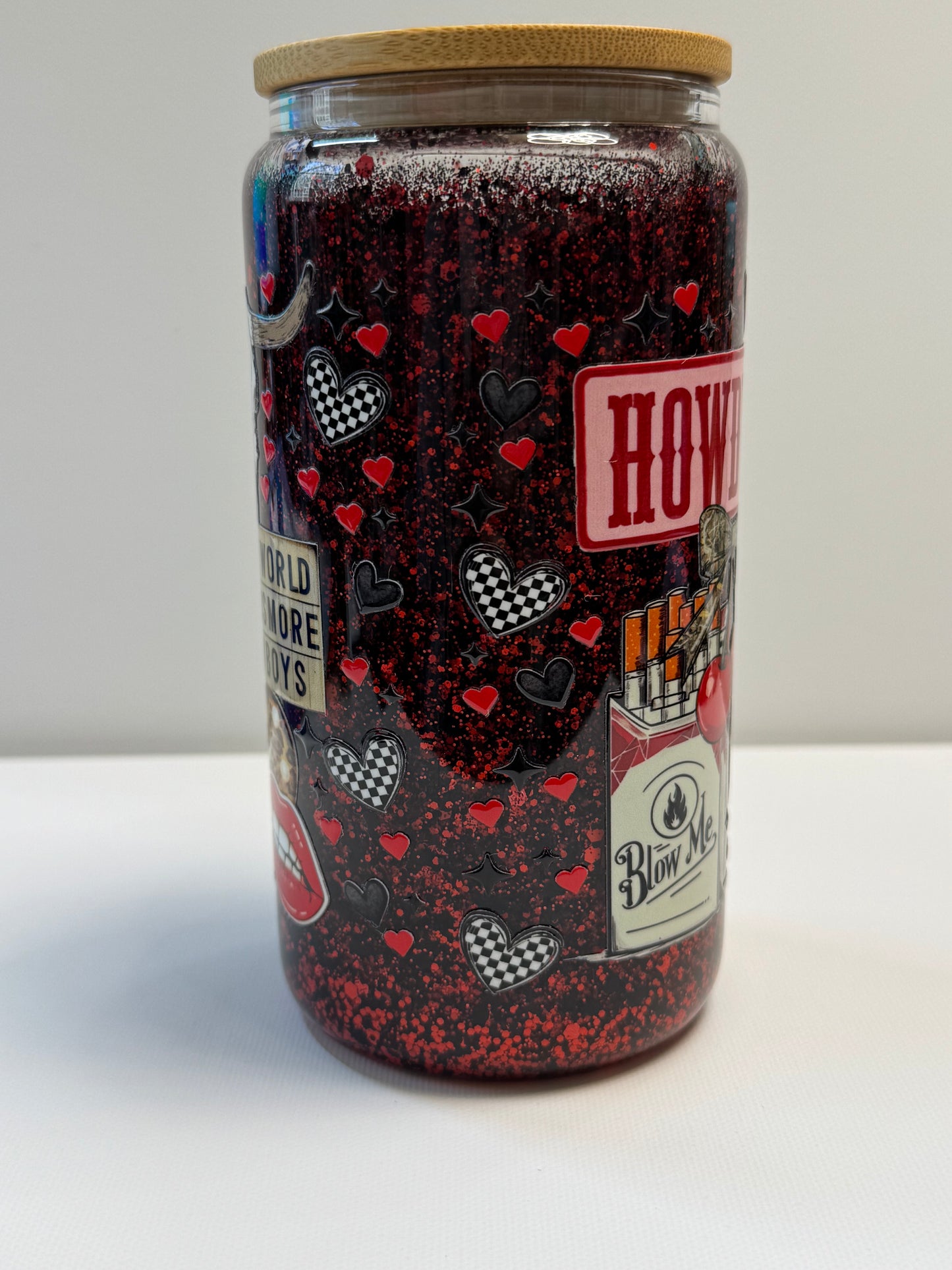 16oz Glass snow globe w/red&black glitter suspended flow. Western