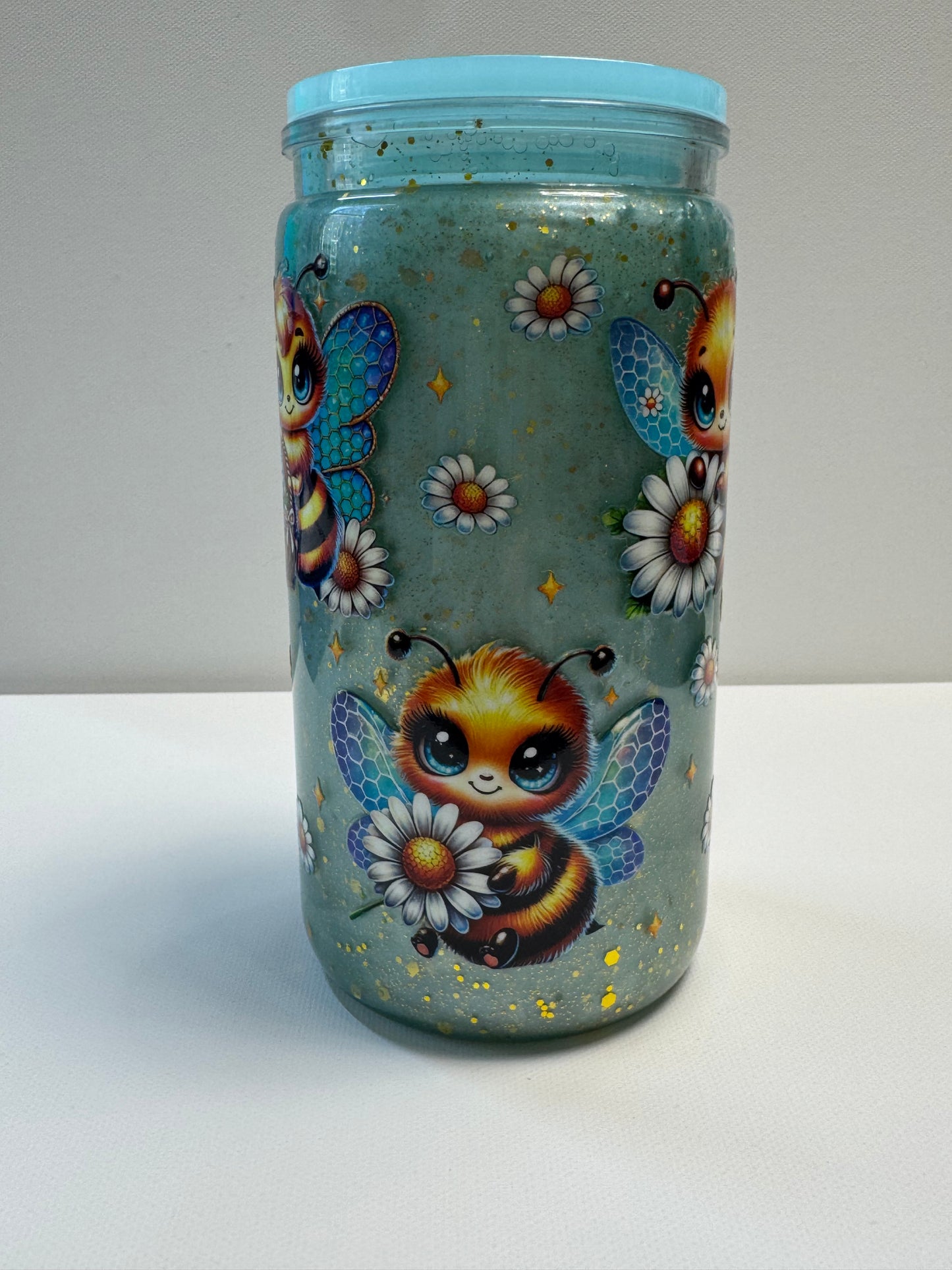 16oz Acrylic snow globe w/blue mica & gold glitter slow flow.