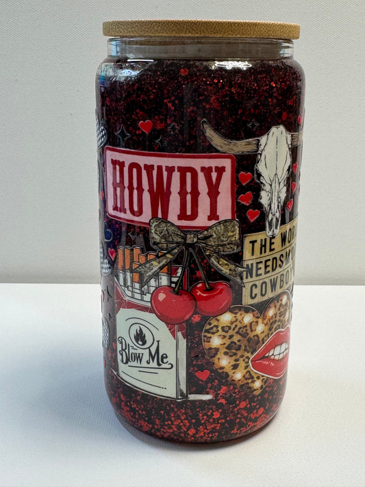 16oz Glass snow globe w/red&black glitter suspended flow. Western