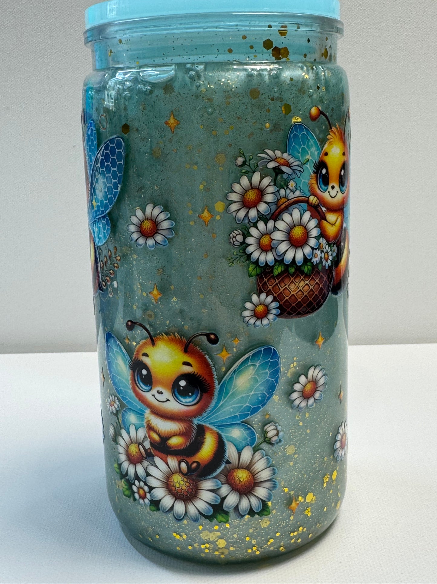 16oz Acrylic snow globe w/blue mica & gold glitter slow flow.