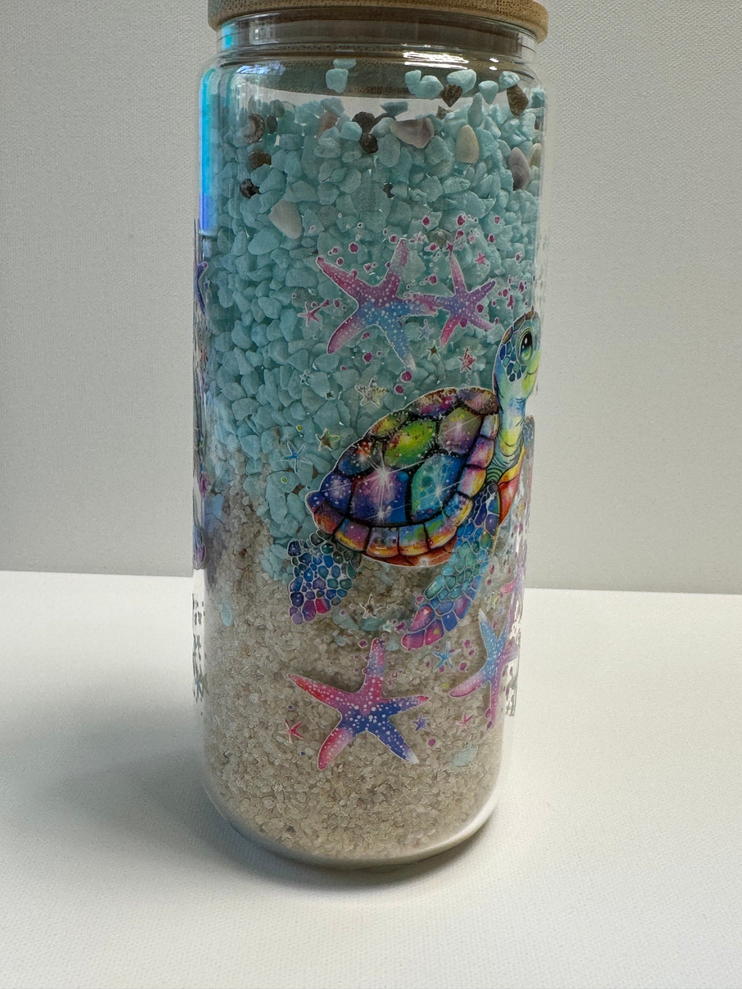 25oz Glass Snow Globe w/sand & blue stone an shells