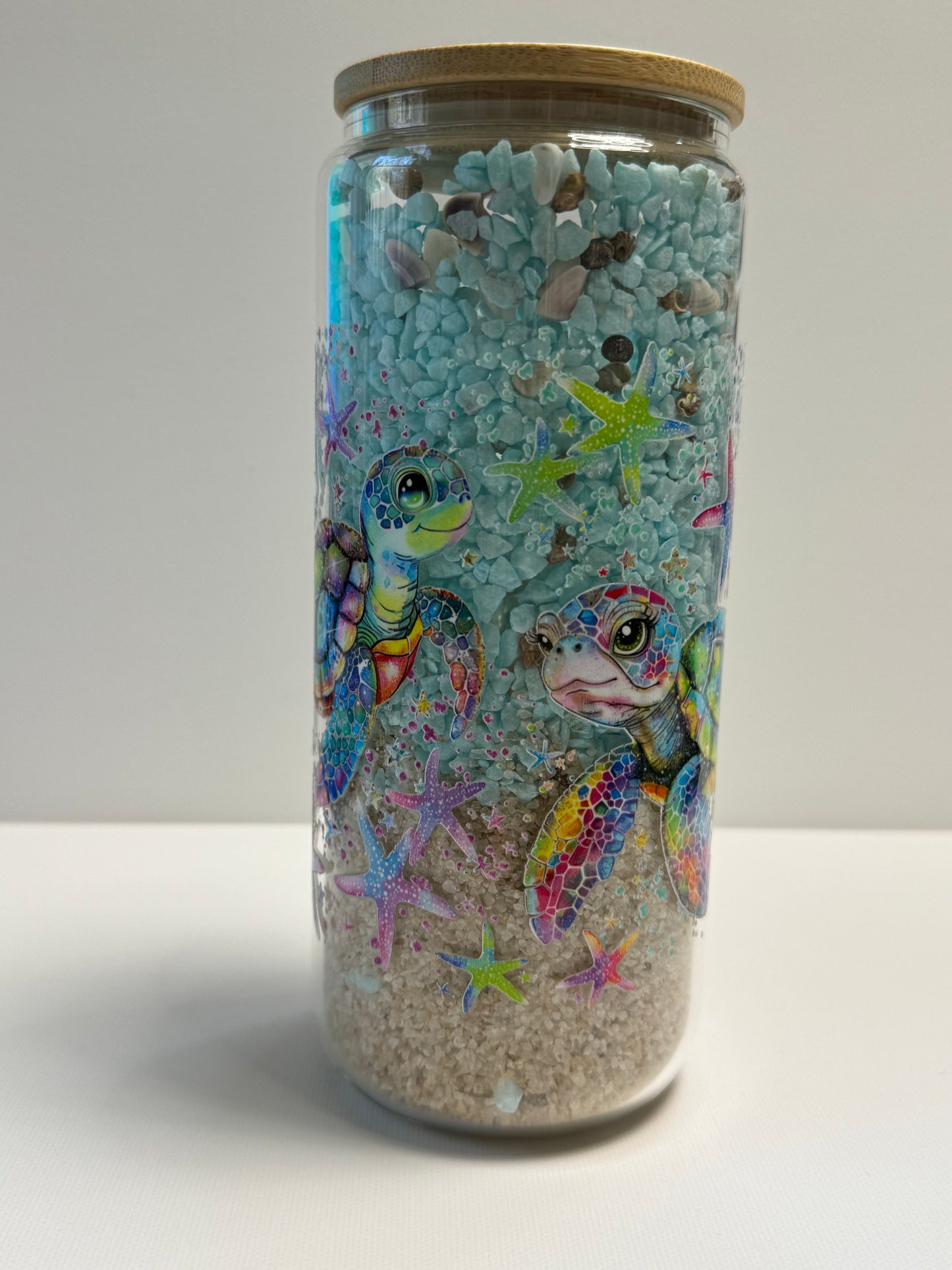 25oz Glass Snow Globe w/sand & blue stone an shells