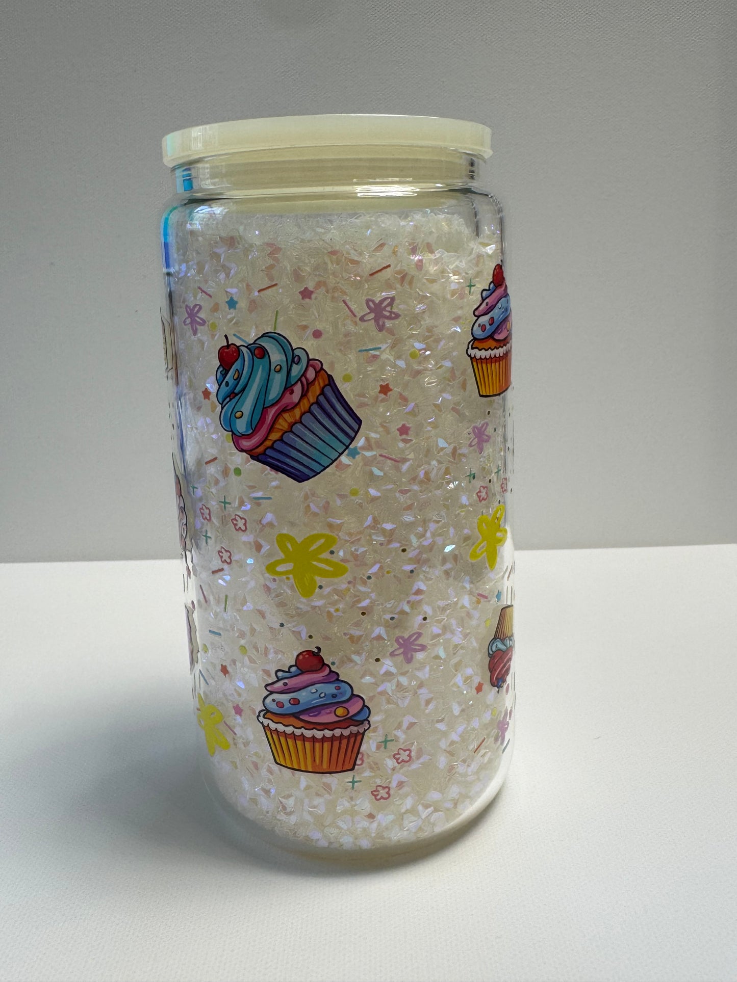 16oz Glass snow globe with sassy wrap and filled with white gems.